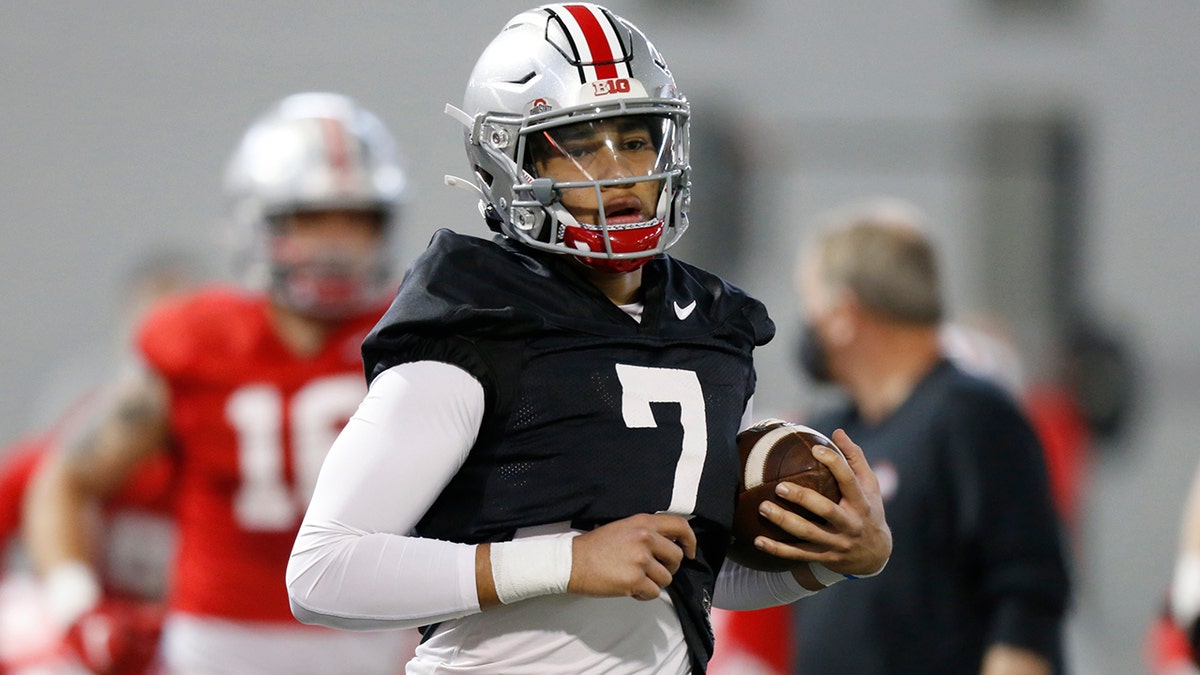 In this April 5, 2021 file photo, Ohio State quarterback C.J. Stroud runs through a drill during an NCAA college football practice in Columbus, Ohio. 