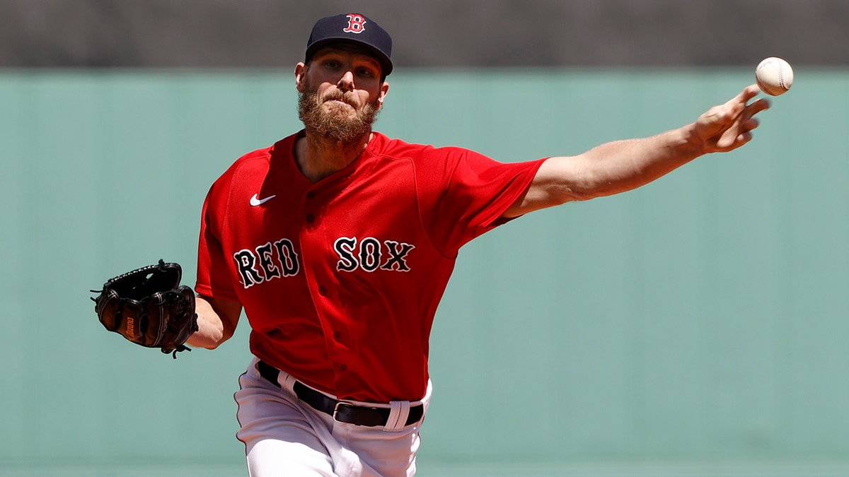 Boston Red Sox starting pitcher Chris Sale delivers against the Tampa Bay Rays during the first inning of a baseball game Monday, Sept. 6, 2021, at Fenway Park in Boston. (AP Photo/Winslow Townson)