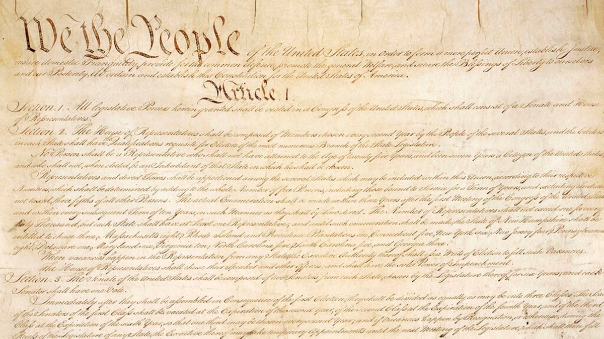 This photo made available by the U.S. National Archives shows a portion of the first page of the United States Constitution. (National Archives via AP)