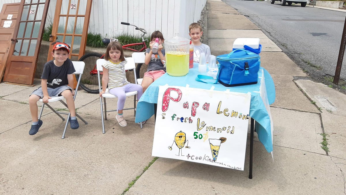 8-year-old Andrew Dembeck raised $200 at his summer lemonade stand to help his local fire department get a new fire truck. Andrew (far right) is pictured with his siblings at the stand. 