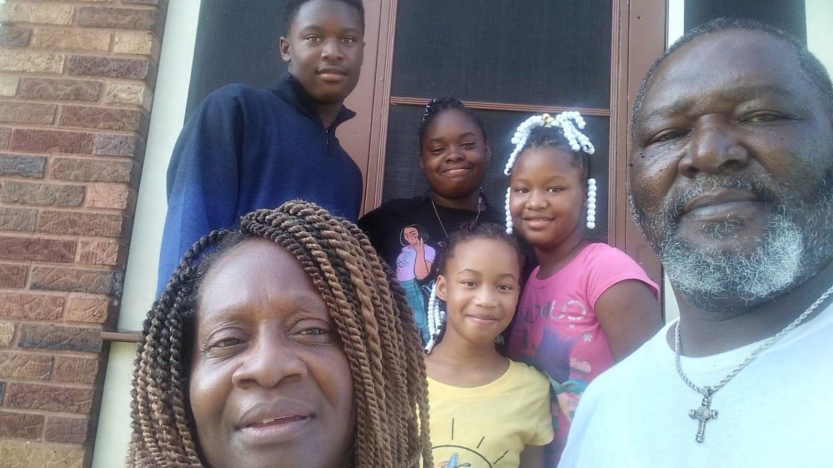 Karen and Tobias Thompson, both 55, from Cincinnati, Ohio, adopted 14-year-olds Wilnya and William and 9-year-olds Shania and Sharleathea last week. 