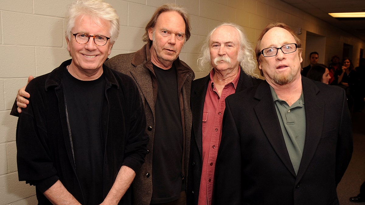 Musicians Graham Nash, Stephen Stills, David Crosby and Neil Young.  