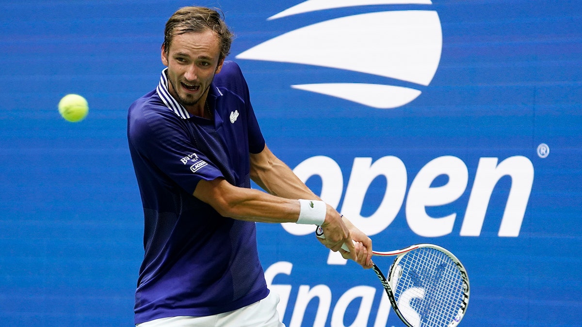 Daniil Medvedev, of Russia, returns a shot to Novak Djokovic, of Serbia, during the men's singles final of the US Open tennis championships, Sunday, Sept. 12, 2021, in New York. (AP Photo/John Minchillo)