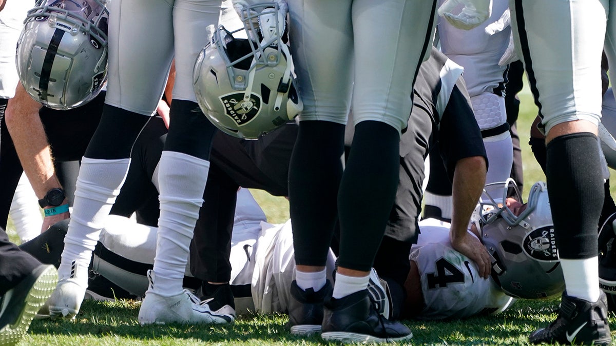 Las Vegas Raiders quarterback Derek Carr (4) is injured on a play during the second half of an NFL football game against the Pittsburgh Steelers in Pittsburgh, Sunday, Sept. 19, 2021. Carr remained in the game.