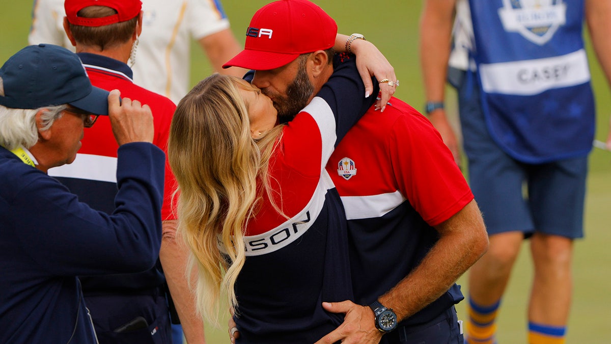 Team USA's Dustin Johnson kisses his partner Paulina Gretzky after Team USA wins The Ryder Cup.