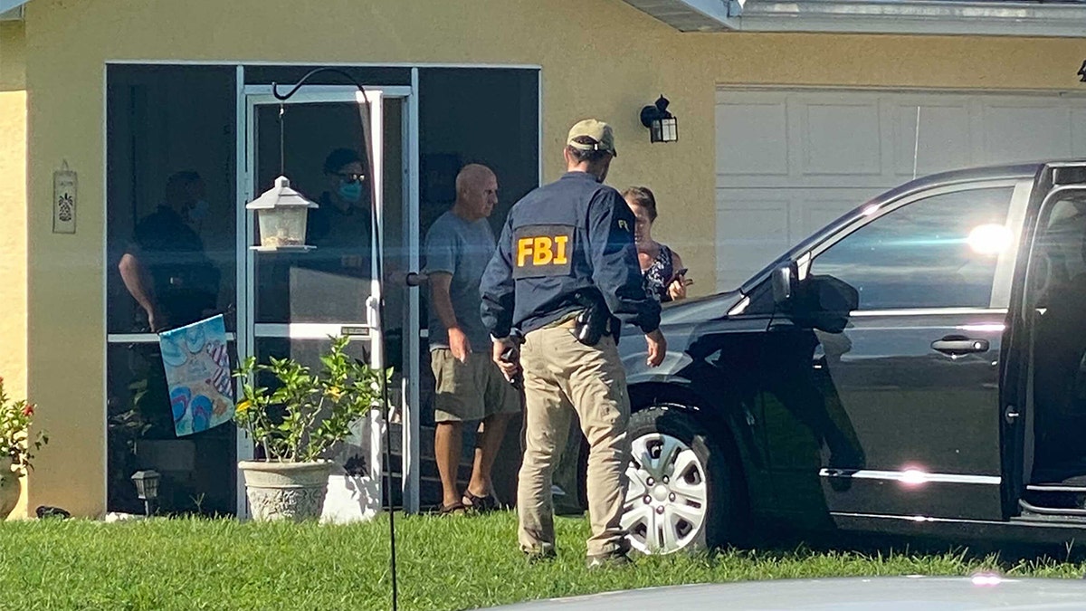 Christopher and Roberta Laundrie exit their home as FBI agents execute a search warrant at their Florida home