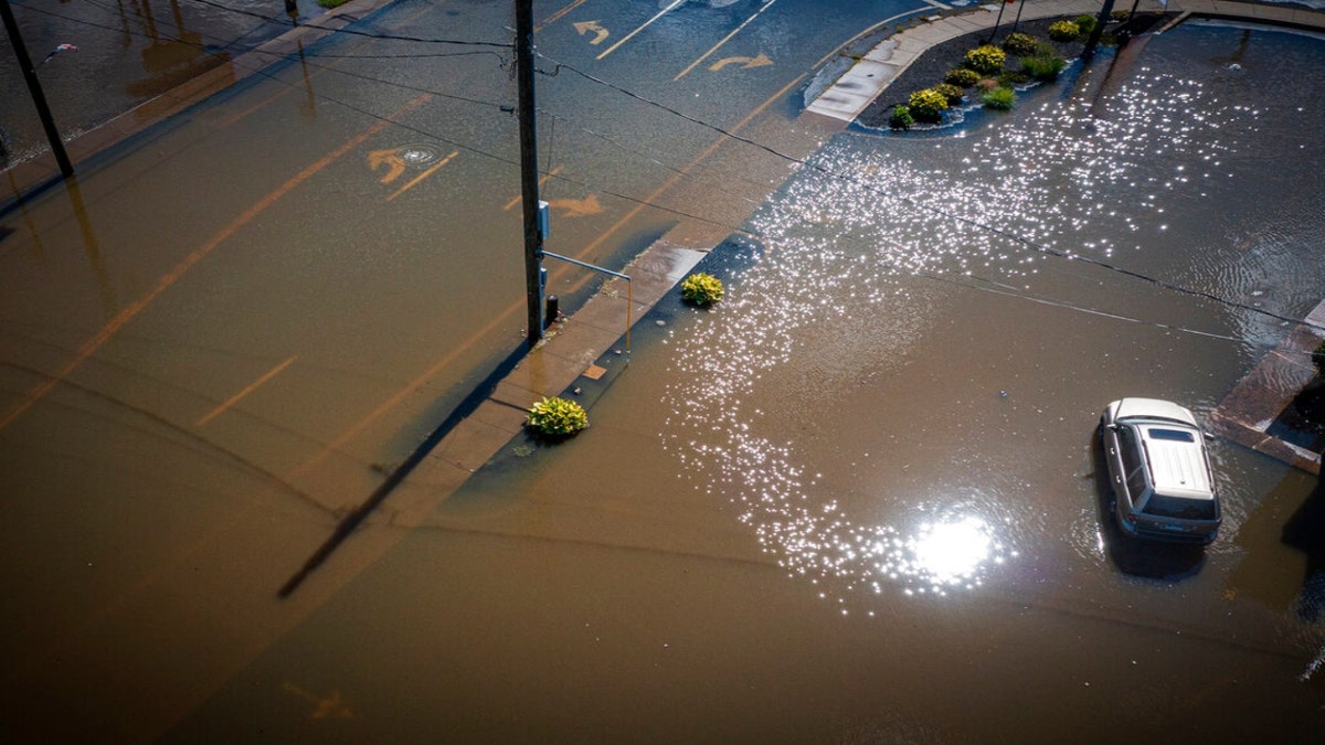 Rainfall from the remnants of Hurricane Ida submerge Mix Street near Farmington Avenue in Bristol, Conn., Thursday, Sept. 2, 2021.