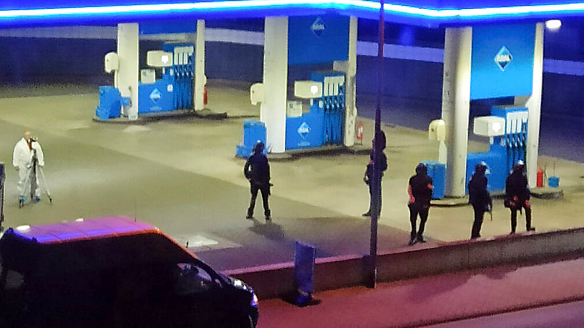 Police officers secure a gas station in Idar-Oberstein, Germany, Sunday, Sept. 19.