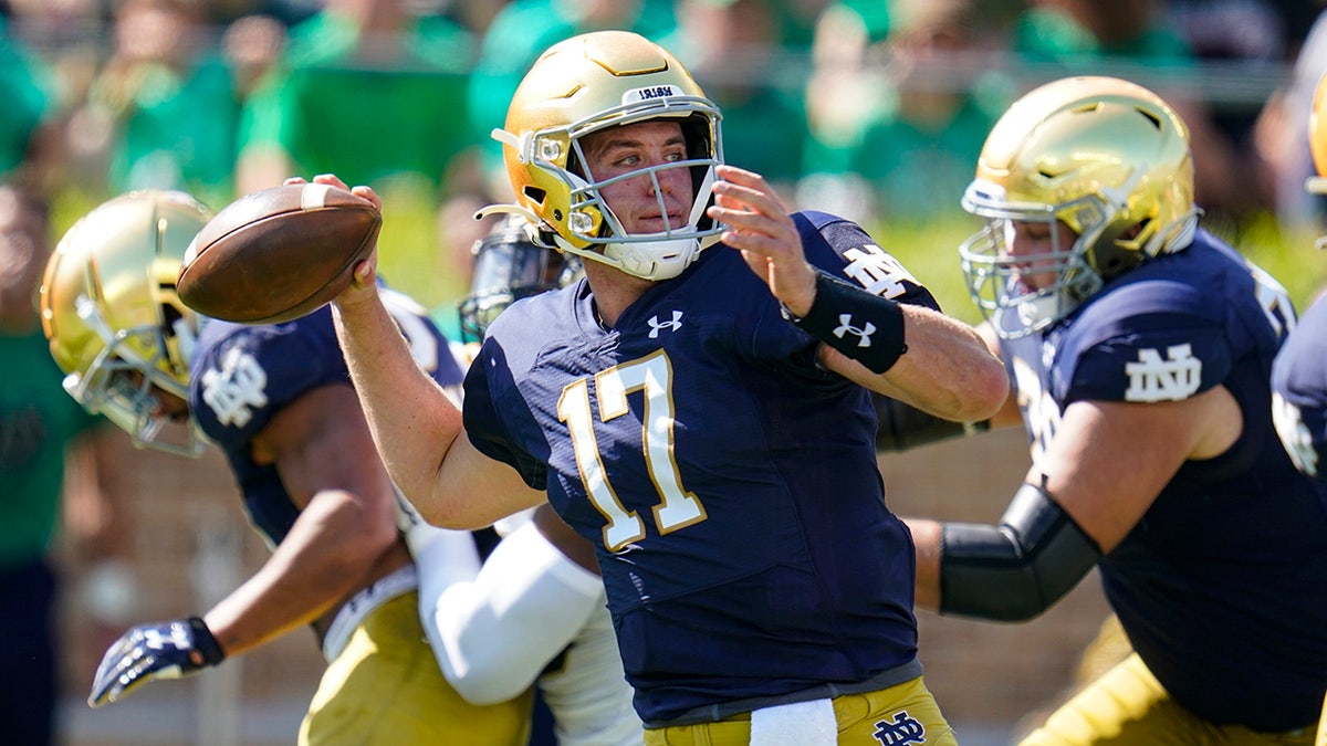 Notre Dame quarterback Jack Coan (17) throws against Purdue during the first half of an NCAA college football game in South Bend, Indiana, Saturday, Sept. 18, 2021.