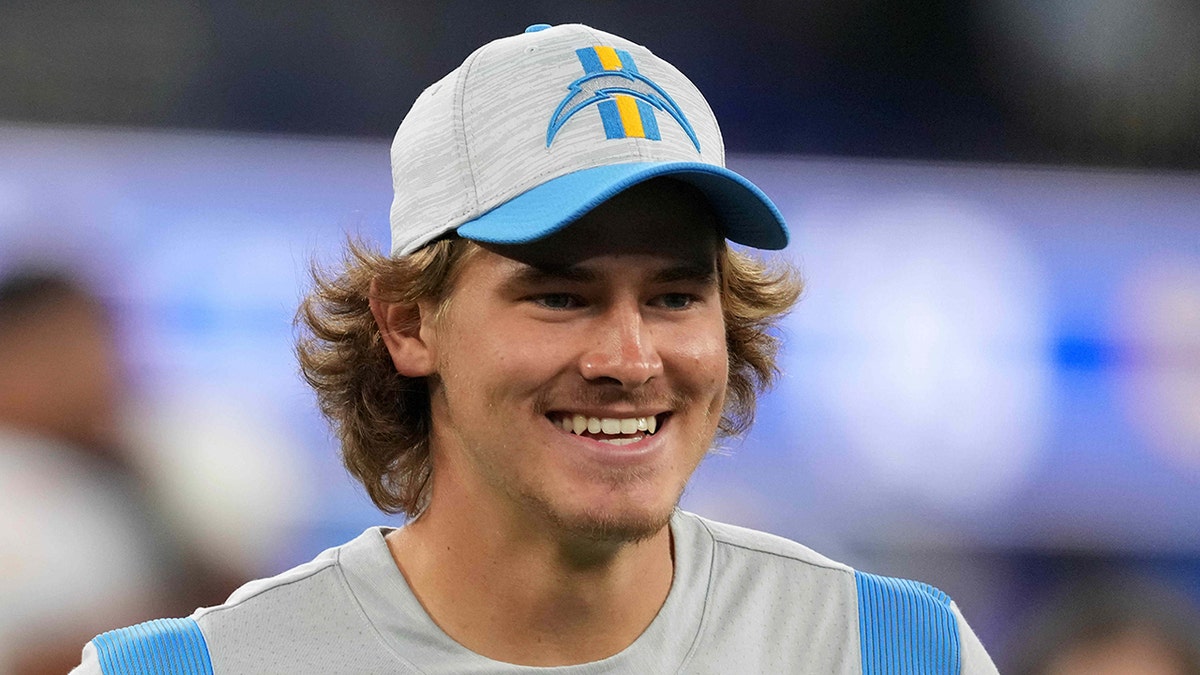 Los Angeles Chargers quarterback Justin Herbert watches from the sidelines in the second half against the Los Angeles Rams Aug. 14, 2021, at SoFi Stadium in Inglewood, Calif. (Kirby Lee-USA TODAY Sports)