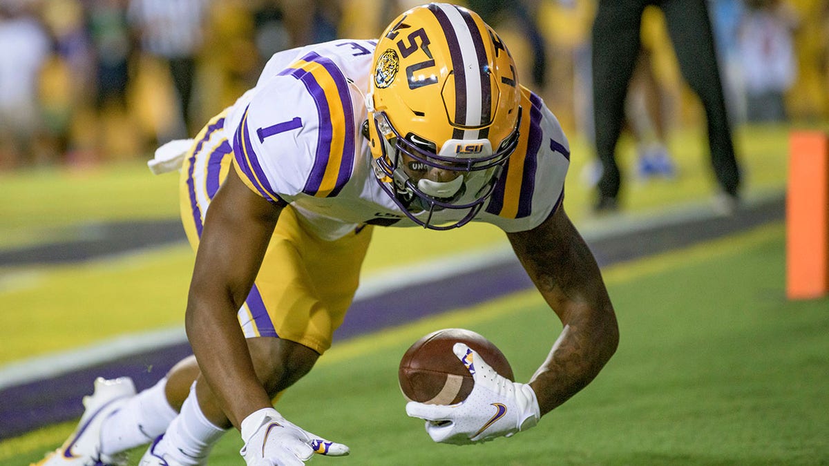 LSU wide receiver Kayshon Boutte scores a touchdown against McNeese State during the second half of an NCAA college football game in Baton Rouge, La., Saturday, Sept. 11, 2021.