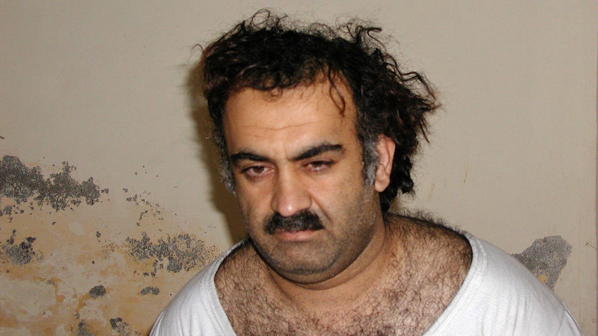 ** FILE ** Khalid Shaikh Mohammed, the alleged Sept. 11 mastermind, is seen shortly after his capture during a raid in Pakistan Saturday March 1, 2003 in this photo obtained by the Associated Press. American authorities investigating the killing of Wall Street Journal reporter Daniel Pearl in Pakistan now believe that he was slain by the hand of Mohammed. The U.S. acknowledgment of Mohammeds suspected role was first reported in the Wall Street Journal Tuesday, Oct. 21, 2003. (AP Photo)