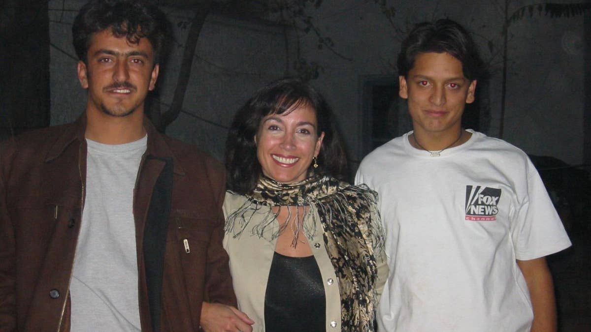 Khorshied Nusratty in Afghanistan. From left to right Massood Sanjer, Khorshied Nusratty, Mustafa Sanjer at FOX News House,,Kabul, 2002?