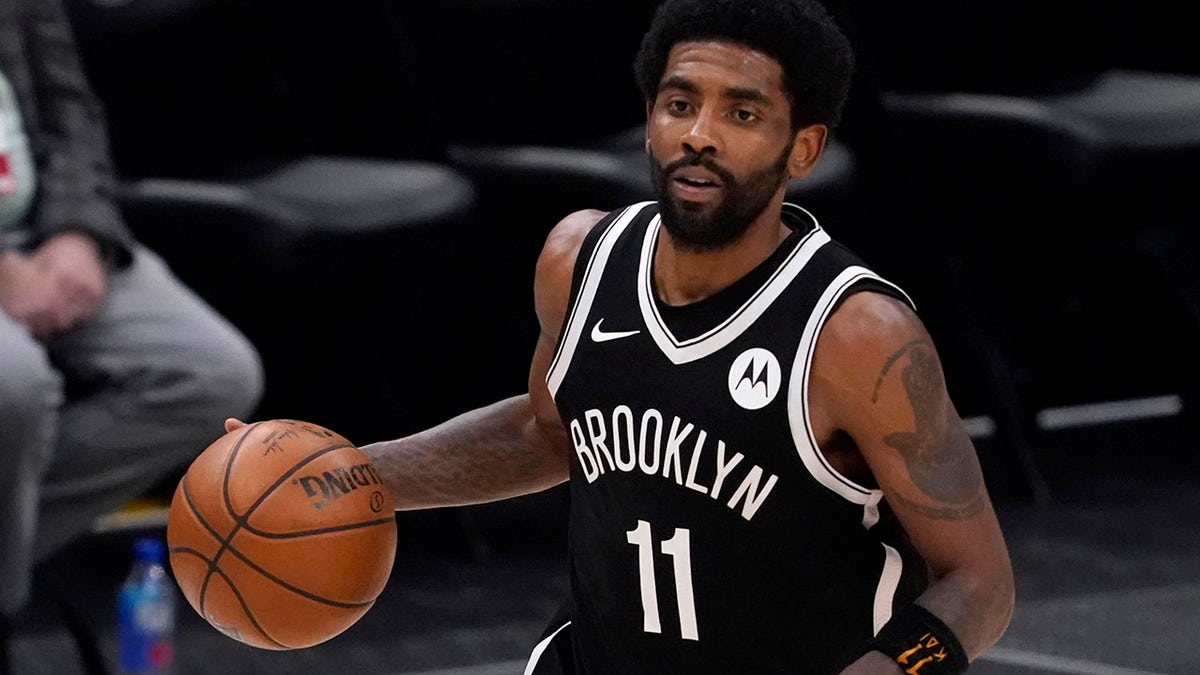 FILE - Brooklyn Nets guard Kyrie Irving handles the ball during an NBA basketball game against the Dallas Mavericks in Dallas, in this Thursday, May 6, 2021, file photo. Unable to attend the Brooklyn Nets' media day, Kyrie Irving asked for privacy Monday when pressed about his vaccination status and availability for home games.