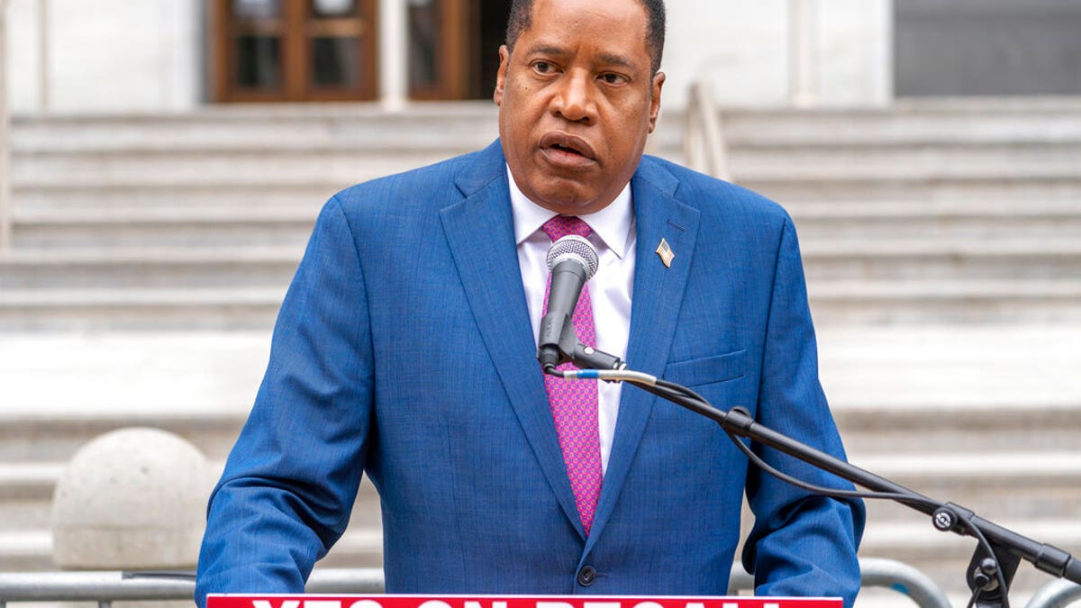 Larry Elder speaks to supporters during a campaign stop outside the Hall of Justice downtown Los Angeles