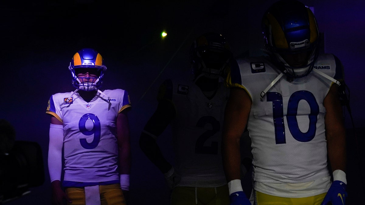 Los Angeles Rams quarterback Matthew Stafford (9) waits alongside wide receiver Cooper Kupp (10) before an NFL football game against the Chicago Bears, Sunday, Sept. 12, 2021, in Inglewood, Calif. (AP Photo/Marcio Jose Sanchez)