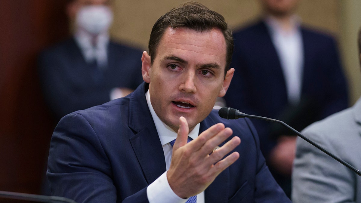 Rep. Mike Gallagher, R-Wis., left, a former Marine, speaks during a roundtable discussion with House Minority Leader Kevin McCarthy, R-Calif.