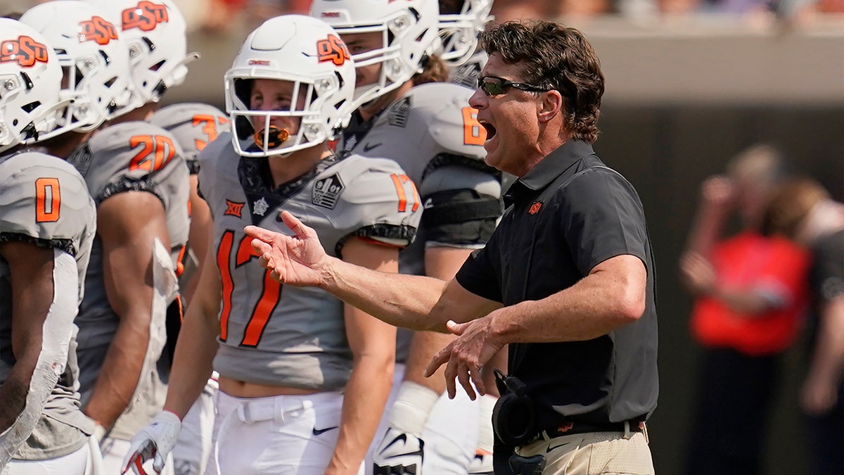 Oklahoma State head coach Mike Gundy gestures during a timeout in the second half of an NCAA college football game against Tulsa, Saturday, Sept. 11, 2021, in Stillwater, Okla.