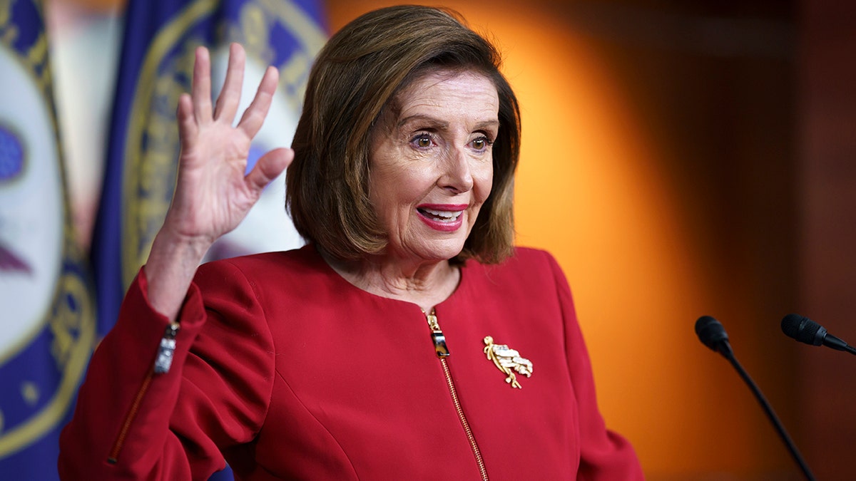 Nancy Pelosi addressing the press