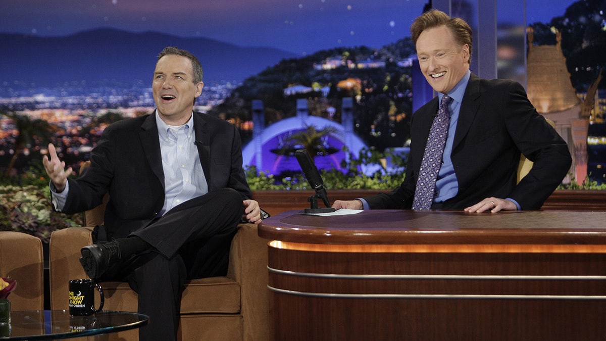 Norm Macdonald was a fan-favorite guest on Conan O'Brien's late-night shows. (Getty Images)
