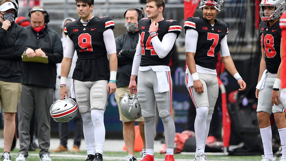 Quarterbacks Jack Miller III #9, Kyle McCord #14 and C.J. Stroud #7, all of the Ohio State Buckeyes watch their teammate during the Spring Game at Ohio Stadium on April 17, 2021 in Columbus, Ohio.