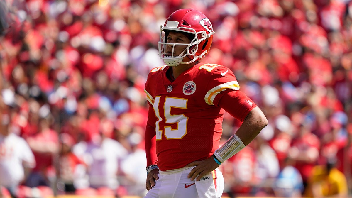 Kansas City Chiefs quarterback Patrick Mahomes (15) watches during the first half of an NFL football game against the Los Angeles Chargers, Sunday, Sept. 26, 2021, in Kansas City, Mo.