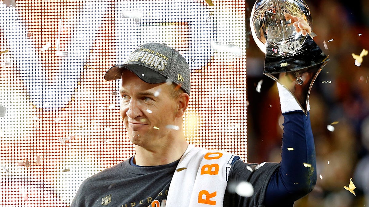 Denver Broncos' quarterback Peyton Manning holds the Vince Lombardi Trophy after the Broncos defeated the Carolina Panthers in the NFL's Super Bowl 50 football game in Santa Clara, California, Feb. 7, 2016.