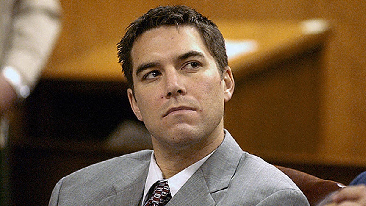 Scott Peterson during his original trial, wearing a gray suit in court