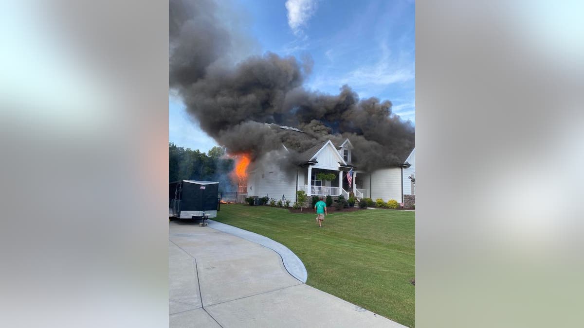 Sean Matthews and Kellie Stanley rushed home while neighbors worked to rescue their 13-year-old dog Memphis. A fire had spread from their front porch to the rest of their home.