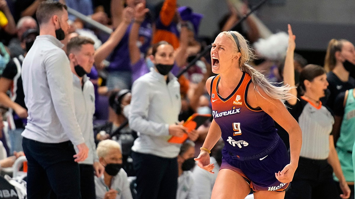 Phoenix Mercury guard Sophie Cunningham (9) reacts after scoring during the second half in the first round of the WNBA basketball playoffs against the Phoenix Mercury, Thursday, Sept. 23, 2021, in Phoenix. Phoenix won 83-82.