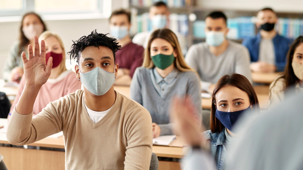 Masked students in a classroom