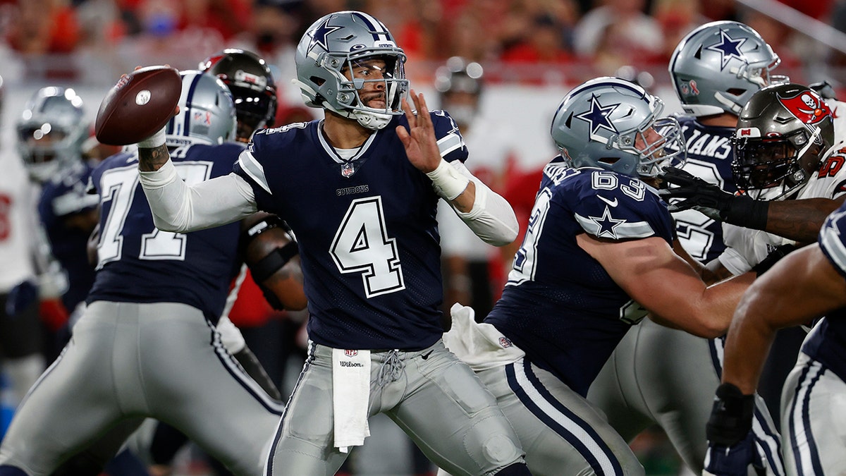 Dallas Cowboys quarterback Dak Prescott (4) throws a pass against the Tampa Bay Buccaneers during the first half of an NFL football game Thursday, Sept. 9, 2021, in Tampa, Fla. (AP Photo/Scott Audette)