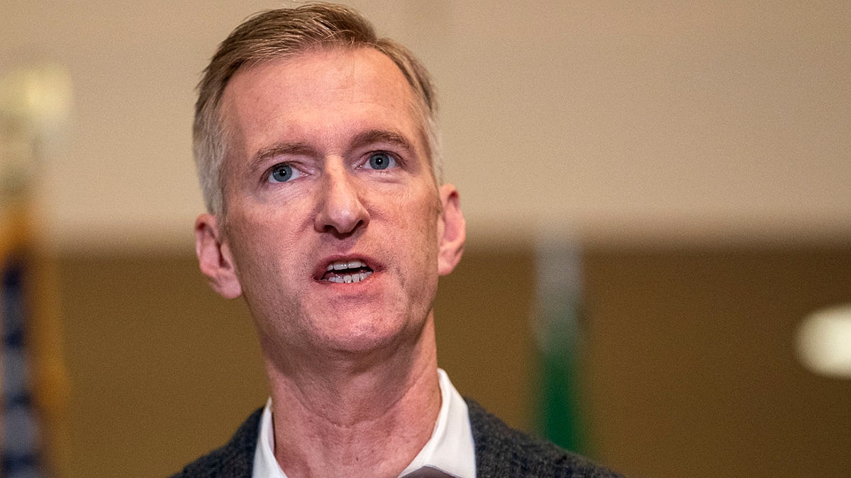 Portland's mayor Ted Wheeler speaks at a press conference in 2020