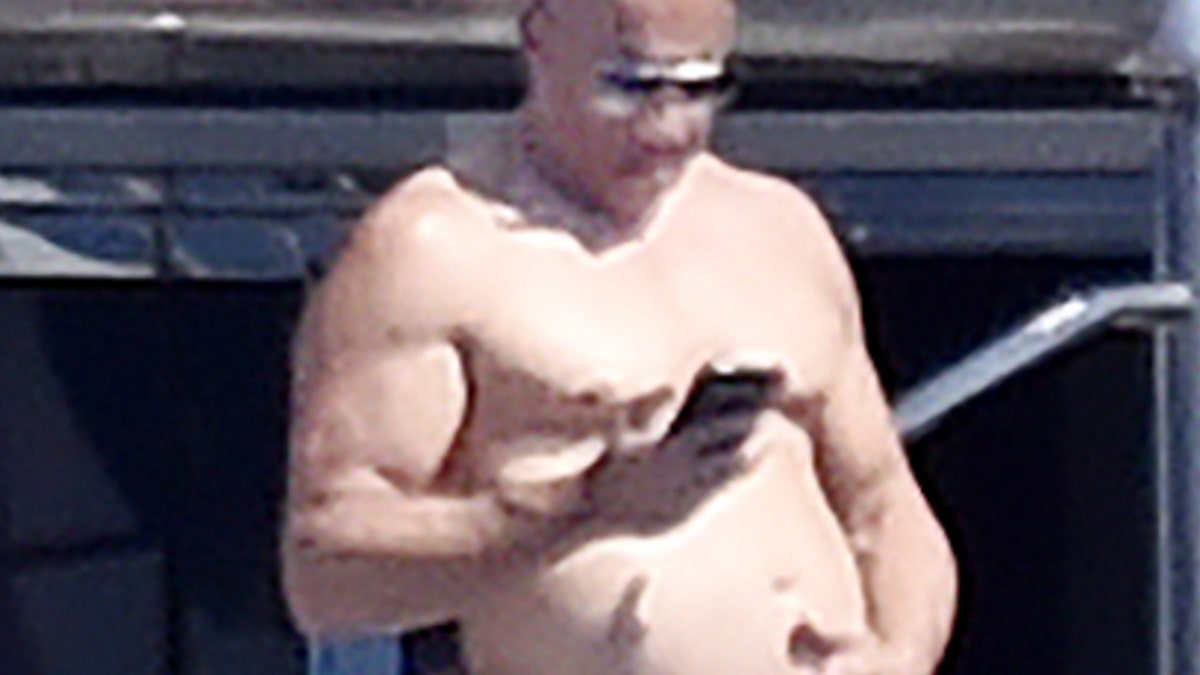 Shirtless Vin Diesel suns himself on luxury yacht in Italy