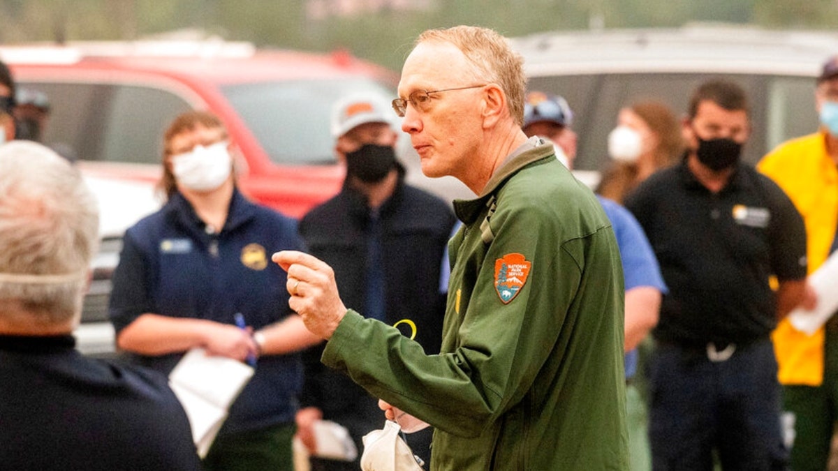 Sequoia and Kings Canyon National Parks Superintendent Clay Jordan speaks with firefighters battling the KNP Complex Fire during a morning briefing in Tulare County, Calif., on Thursday, Sept. 16, 2021. Jordan discussed the need to protect the parks' giant sequoia trees from high-intensity fire in the upcoming days. 