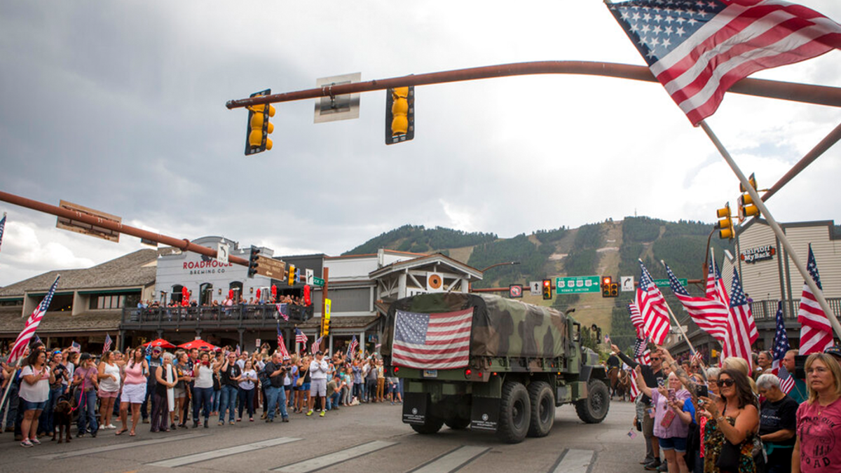Community members honor Marine Lance Cpl. Rylee McCollum during a procession in Jackson, Wyo., Friday, Sept. 10, 2021.