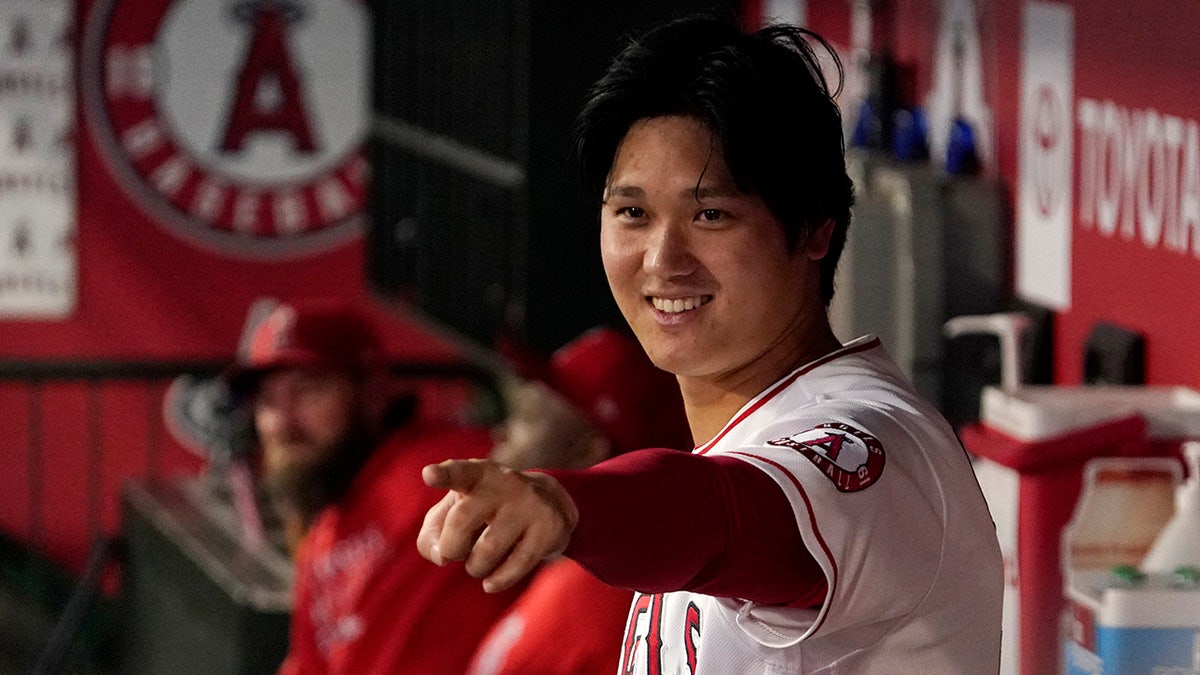 Los Angeles Angels designated hitter Shohei Ohtani gestures to other players in the dugout during the first inning of a baseball game against the Houston Astros Thursday, Sept. 23, 2021, in Anaheim, Calif. 