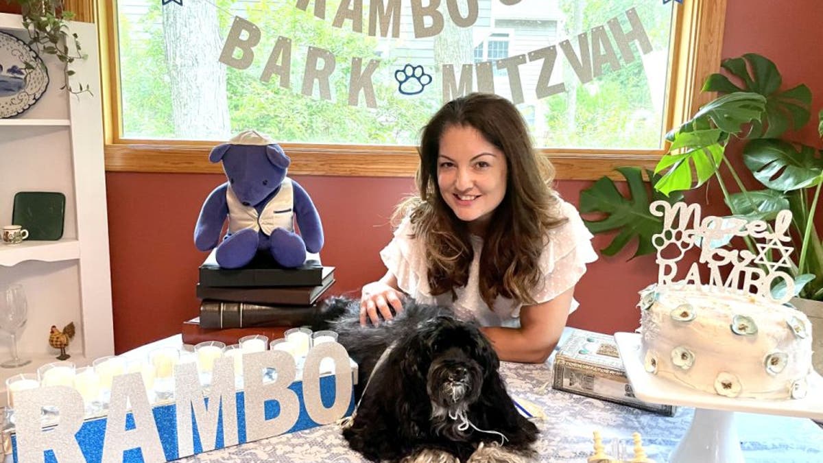 Rambo's "Bark Mitzvah" was outfitted with personalized decor. The 13-year-old Havenese pup also received special dog-sized attire and peanut butter cake. Here he sits with his owner Ruth Ellenberg.