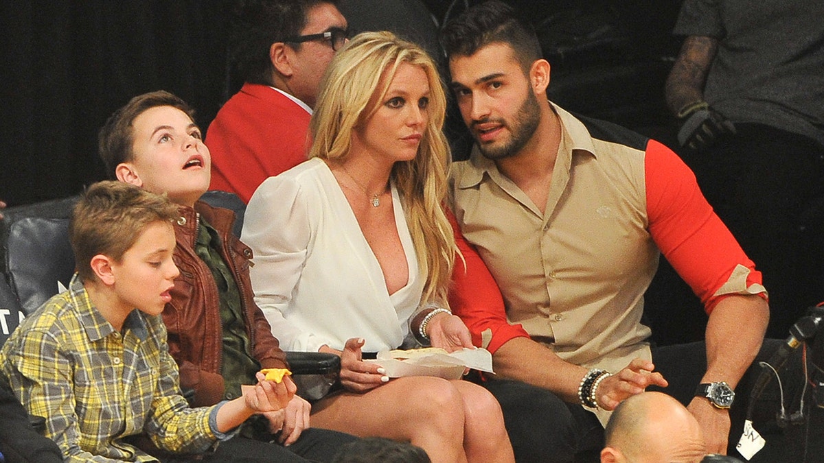 Sean Federline, Jayden James Federline, Britney Spears and Sam Asghari attend a basketball game between the Los Angeles Lakers and the Golden State Warriors at Staples Center on November 29, 2017 in Los Angeles, California.  