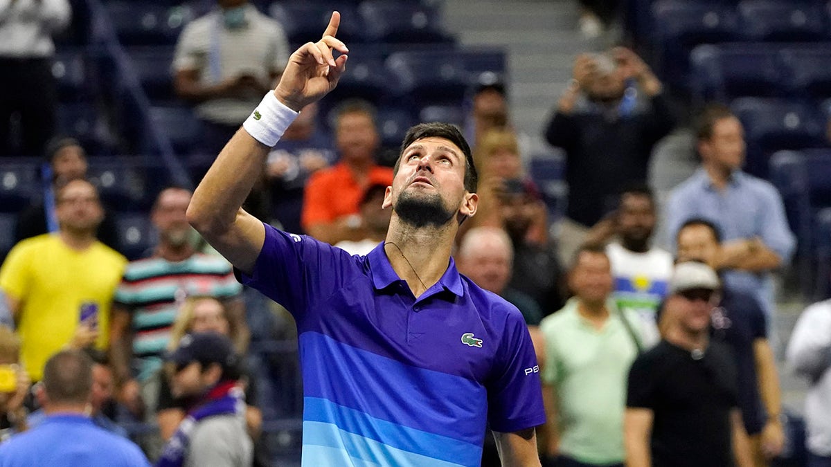 Novak Djokovic of Serbia motions and looks up after defeating Matteo Berrettini of Italy during the quarterfinals of the U.S. Open Sept. 9, 2021, in New York.