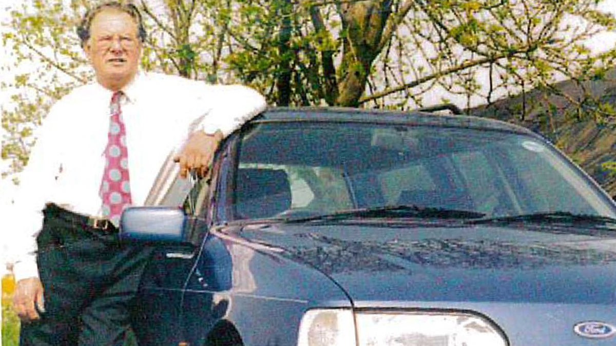 George Allen seen with the newest car in the collection, a 1991 Ford Sierra Estate.