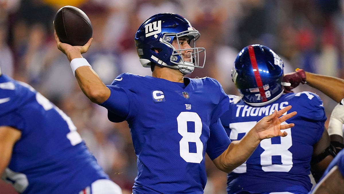 New York Giants quarterback Daniel Jones (8) throws the ball during the first half of an NFL football game against the Washington Football Team, Thursday, Sept. 16, 2021, in Landover, Md.