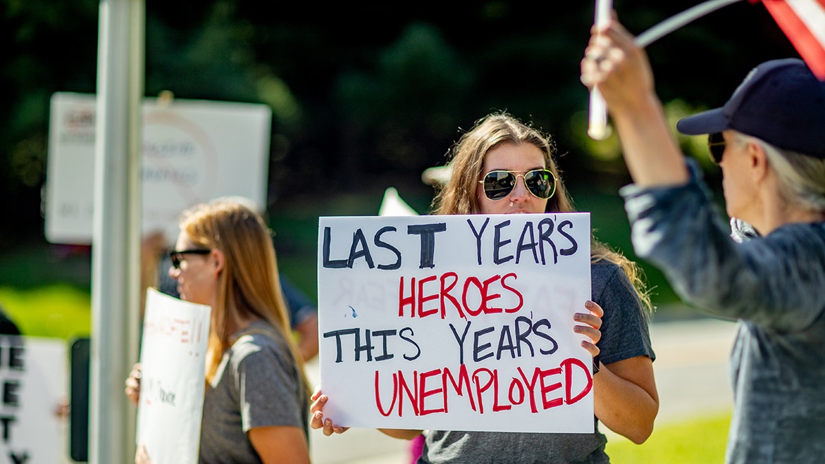 Smithtown, N.Y.: A sign held by a healthcare worker reads "Last Year's Heroes, This Year's Unemployed" at a protest at St. Catherine of Siena Hospital in Smithtown, New York, on Sept. 27, 2021. (Photo by Raychel Brightman/Newsday RM via Getty Images)