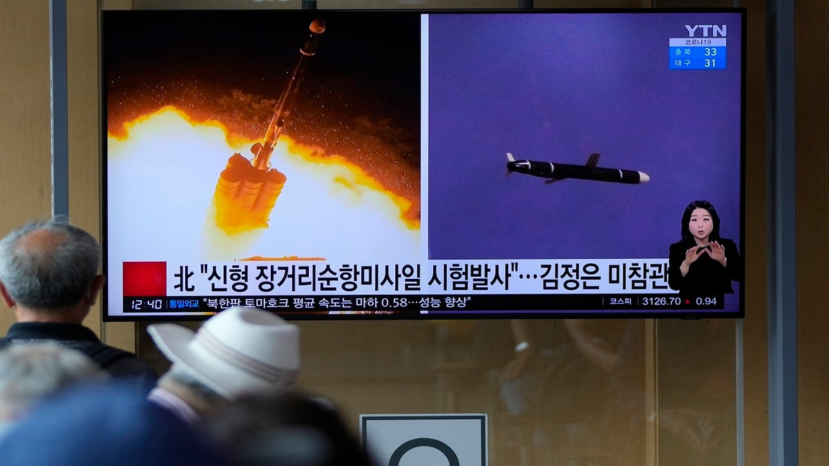 People watch a TV screen showing a news program reporting about North Korea's long-range cruise missiles tests with images in Seoul, South Korea, on Monday. (Associated Press)