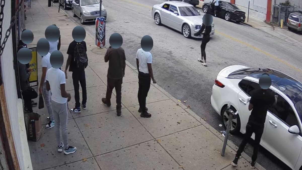 Philadelphia police released footage of a drive-by shooting that killed one and injured five others in broad daylight on Monday in the hope of identifying the suspect vehicle.