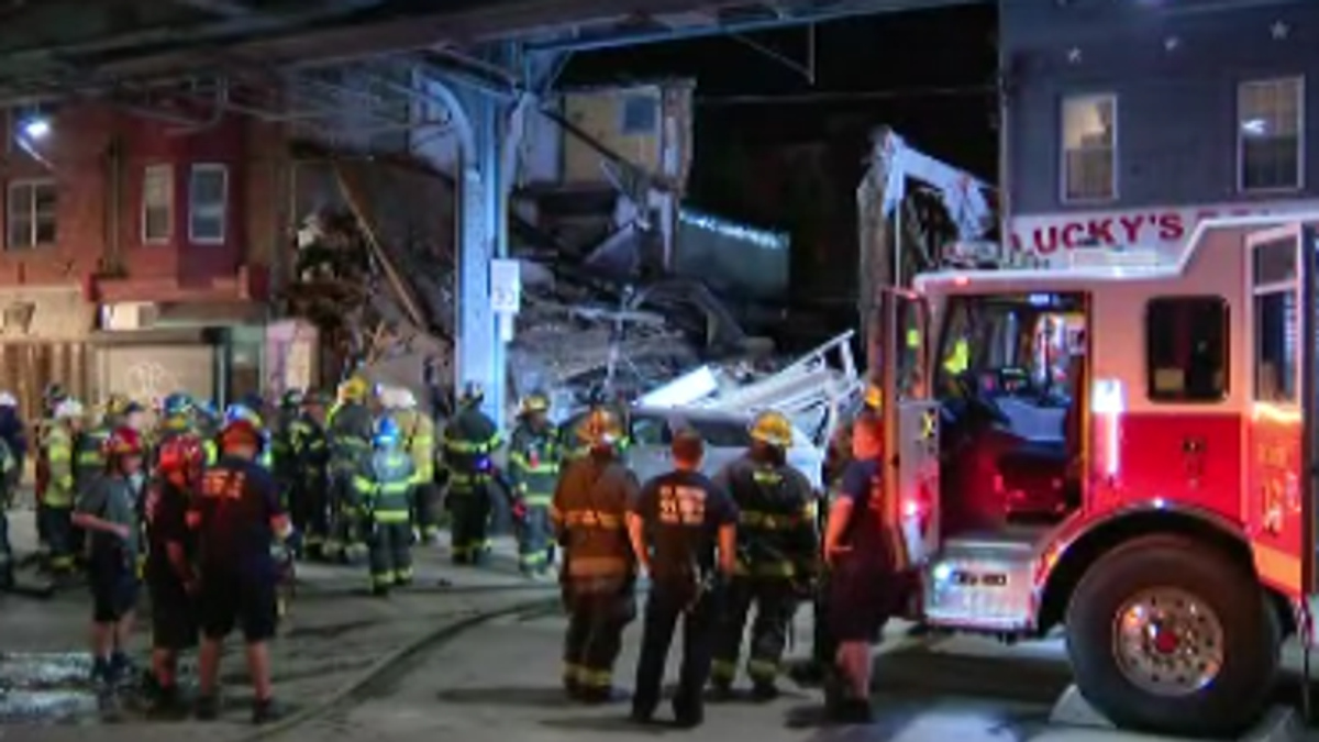 Philadelphia firefighters and other emergency responders gather at the scene of Thursday night's building collapse in the city's Kensington neighborhood. (FOX 29, Philadelphia)