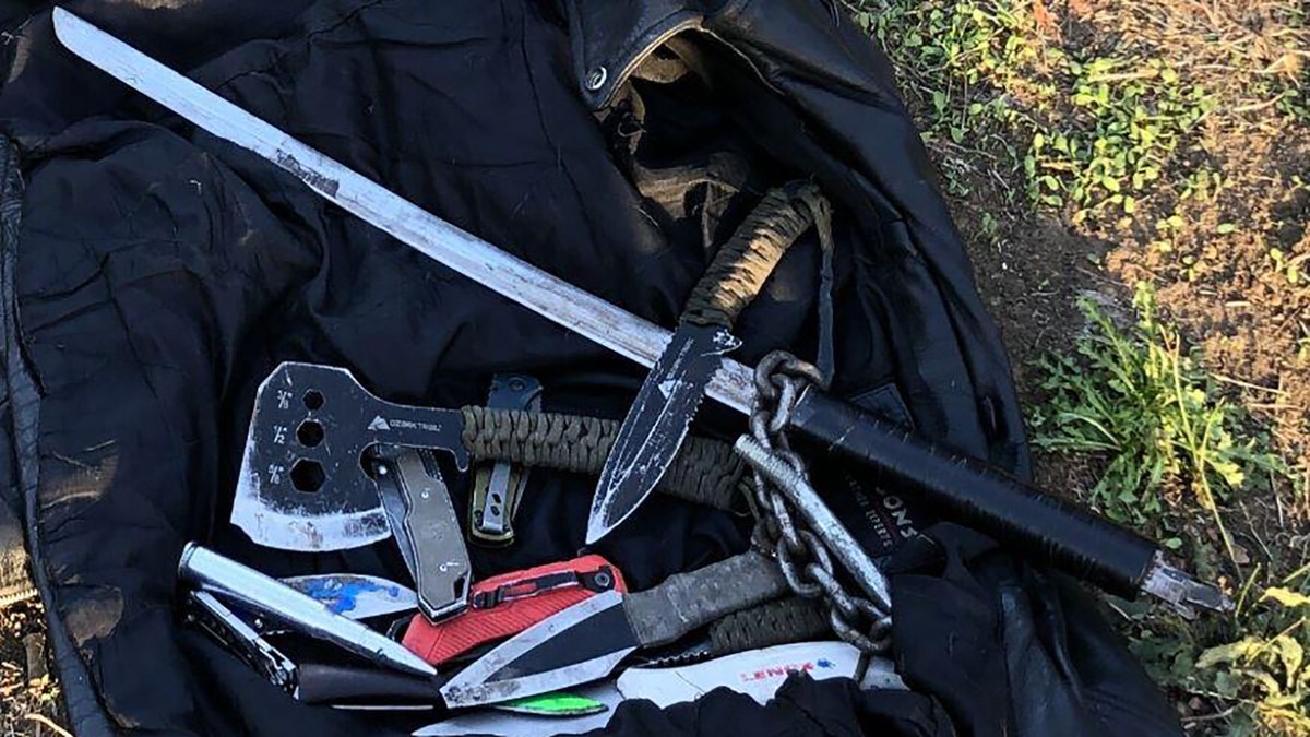 An Oregon man was arrested Saturday after breaking into a Portland home and charging at responding officers with a sword and ax, authorities said.