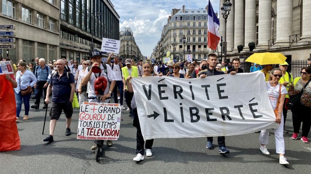 PARIS, FRANCE - SEPTEMBER 4: People attend a protest against Covid-19 restrictions, government's decision of vaccination obligation and Covid-19 health license application brought to some professions in order to combat the new type of coronavirus (Covid-19) in Paris, France on September 4, 2021. (Photo by Yusuf Ozcan/Anadolu Agency via Getty Images)