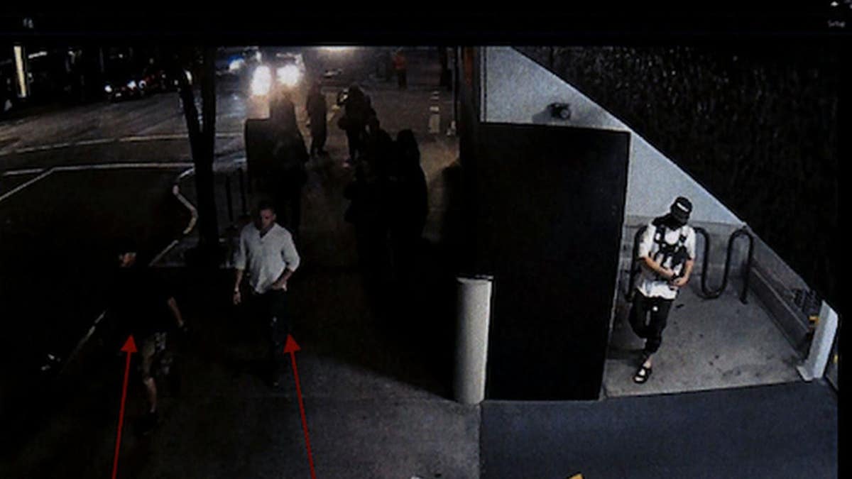 Security camera footage from Aug. 29, 2020, shows Michael Reinoehl in an alcove of a Portland, Oregon, parking garage while Aaron Danielson and a friend walk by, according to police. (Portland Police Bureau)