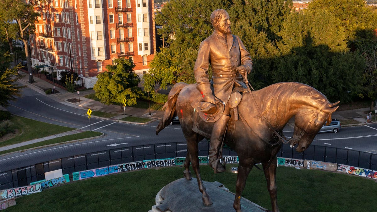 The statue of Confederate General Robert E. Lee is bathed in the late sun on Monument Avenue in Richmond, Virginia, Monday, Sept. 6, 2021.